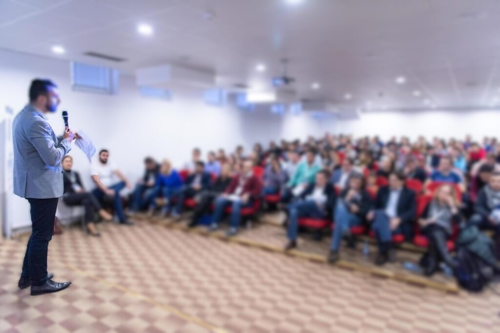 businessman-giving-presentations-at-conference-room-free-photo